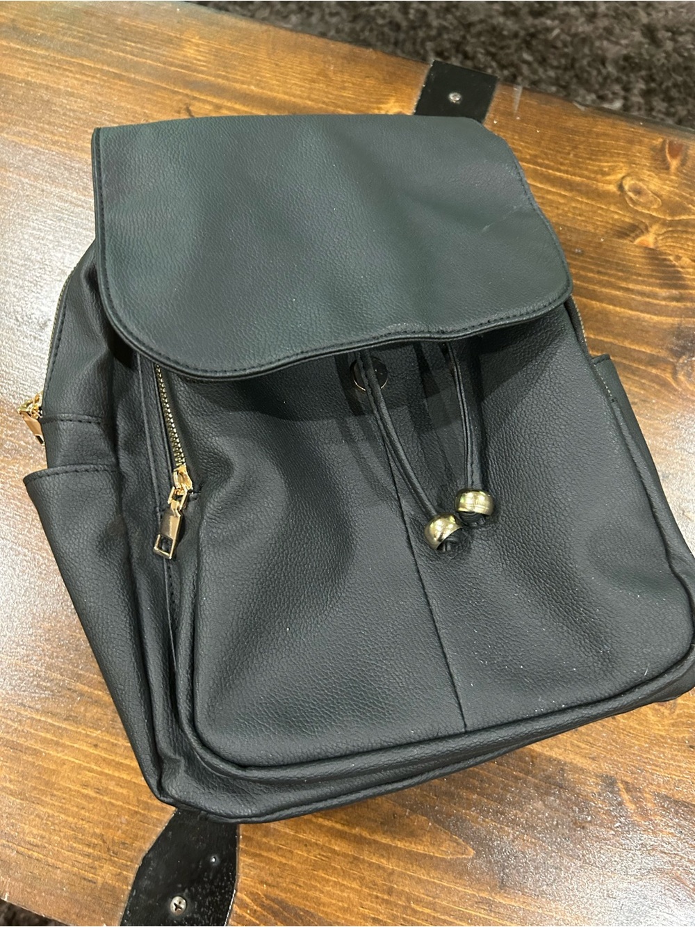 Marshalls Black Backpack with Gold Accents Lots of pockets with zippers.